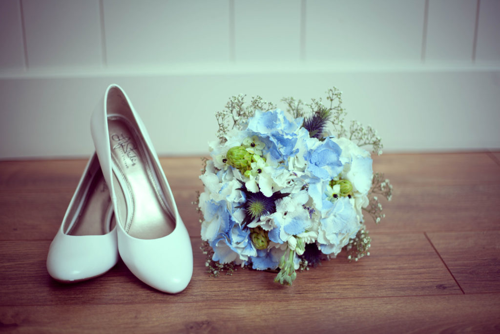 elope to ireland bouquet and shoes bride buds and blooms florist