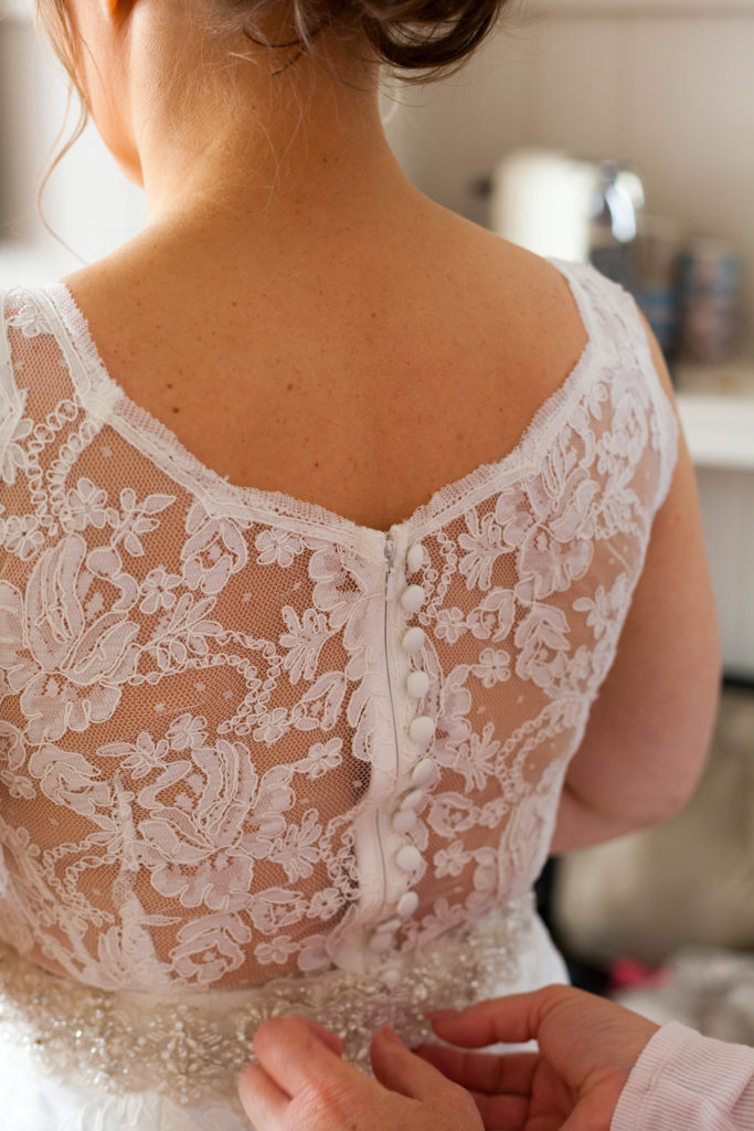 Annie helping bride with dress elope to ireland