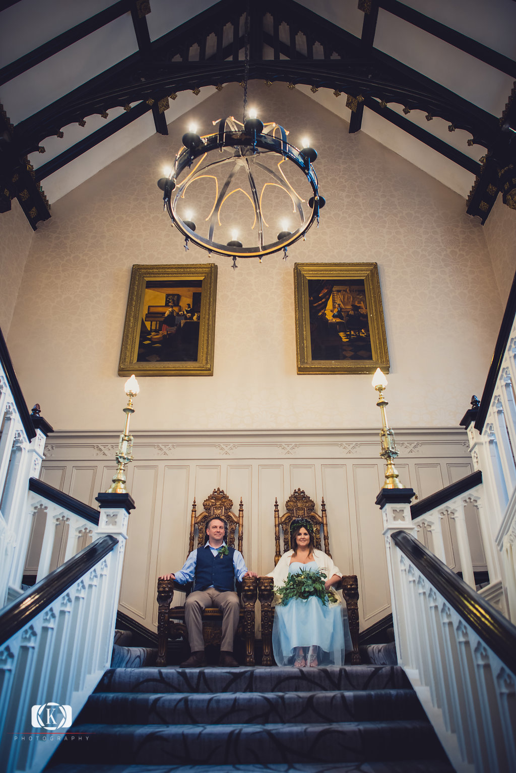 Elope to Ireland in dublin on a cliff at the Howth Clontarf Castle bride and groom sitting on thrones