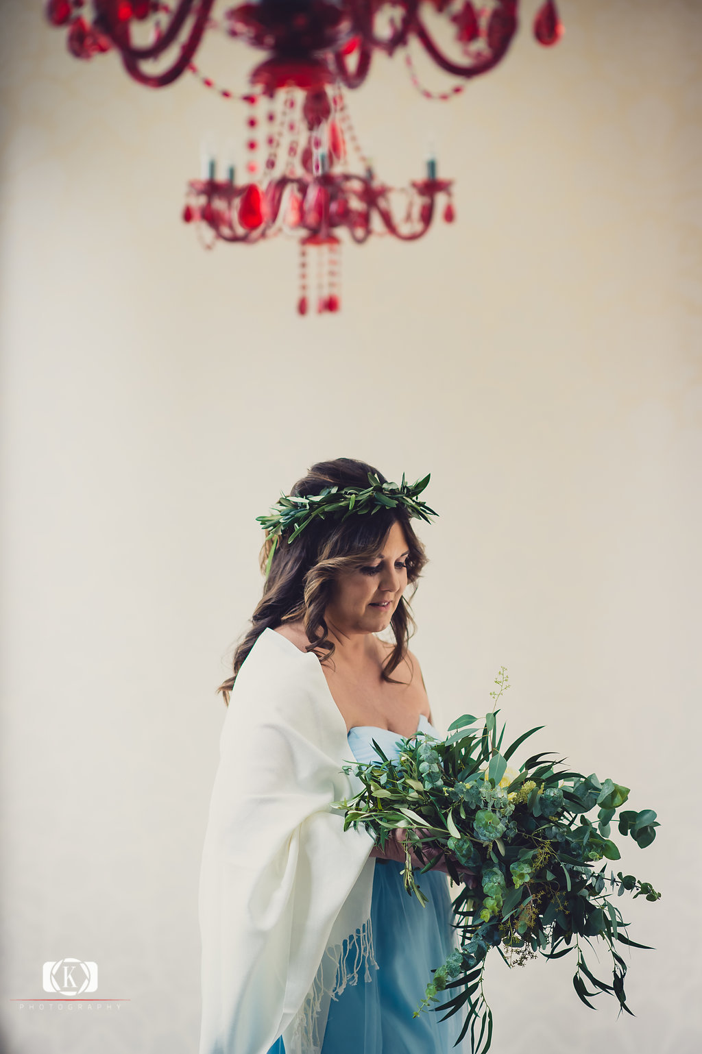 Elope to Ireland elopement in dublin ireland on a cliff bride with flowers before the ceremony
