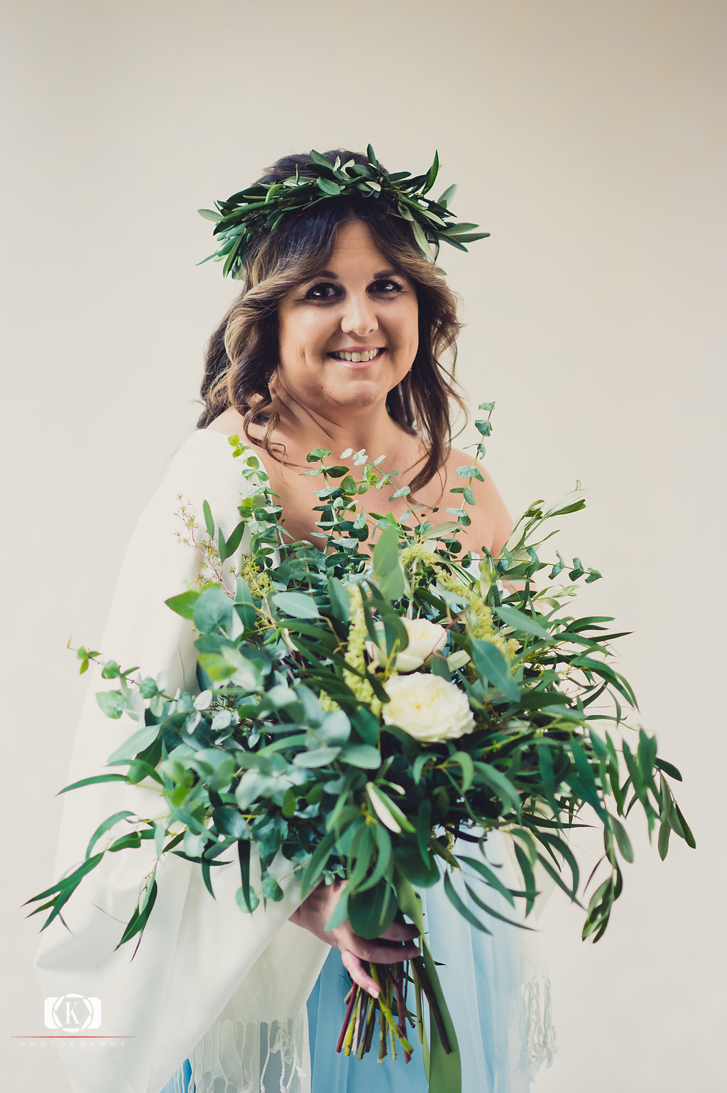 Elope to Ireland elopement in dublin ireland on a cliff bride with flowers before the ceremony