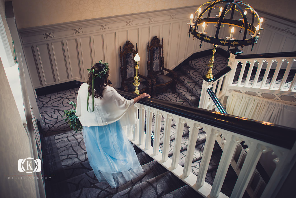 Elope to Ireland elopement in dublin ireland on a cliff - bride walking down the stairs before the ceremony Clontarf Castle North Carolina and Florida Cliffside Wedding in Ireland