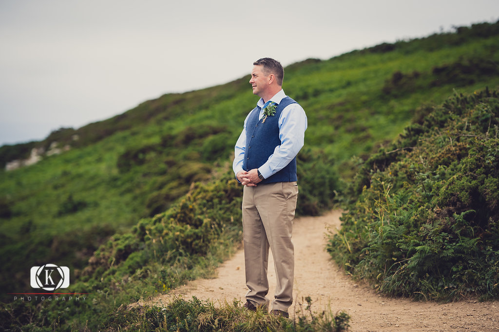 Elope to Ireland elopement in dublin on Howth lighthouse walk cliff groom waiting for bride first look