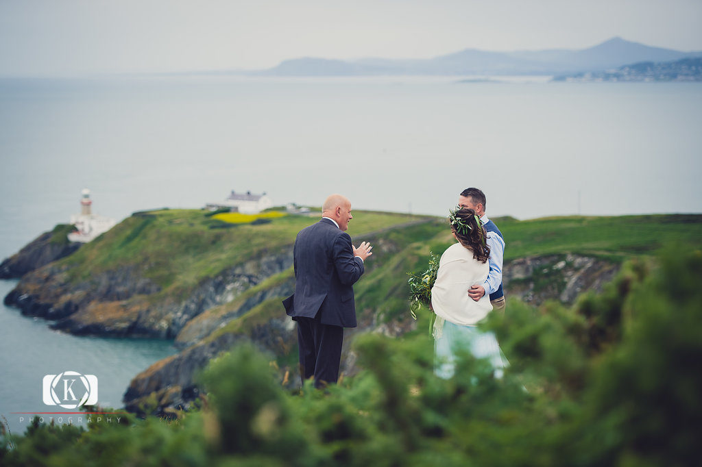 Elope to Ireland in dublin on a cliff at the Howth lighthouse walk bride and groom ceremony with spiritual ceremonies. North Carolina and Florida Cliffside Wedding in Ireland