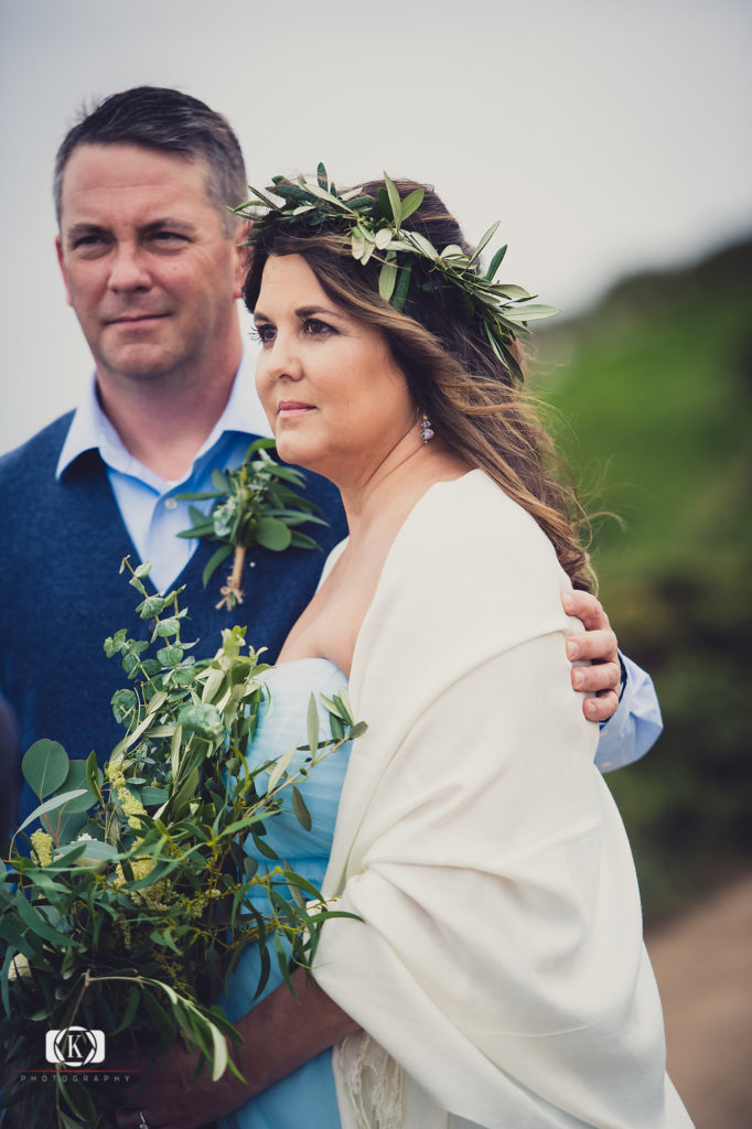 Elope to Ireland in dublin on a cliff at the Howth lighthouse walk bride and groom ceremony with spiritual ceremonies