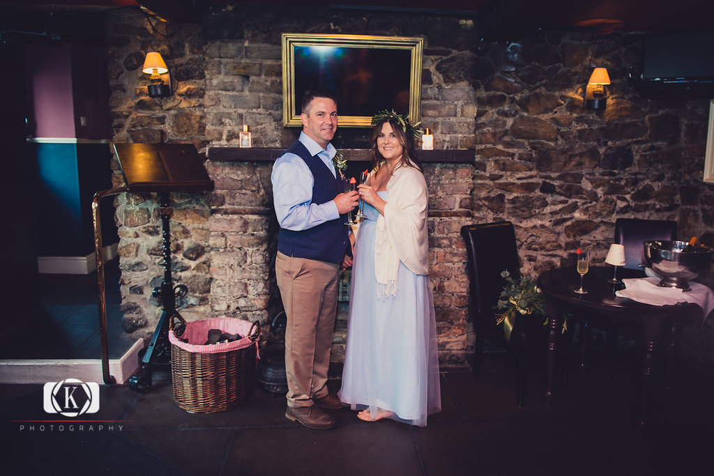 Elope to Ireland in dublin on a cliff at the Howth lighthouse walk bride and groom at clontarf castle