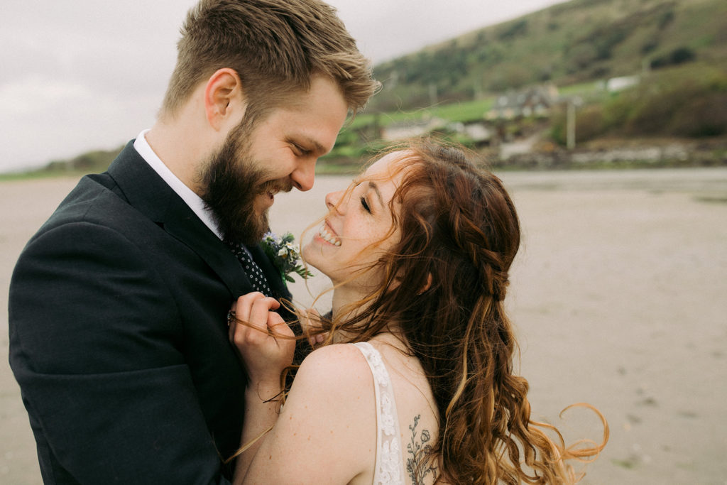 Coastal intimate Wedding in Ireland newly weds kissing on the beach 