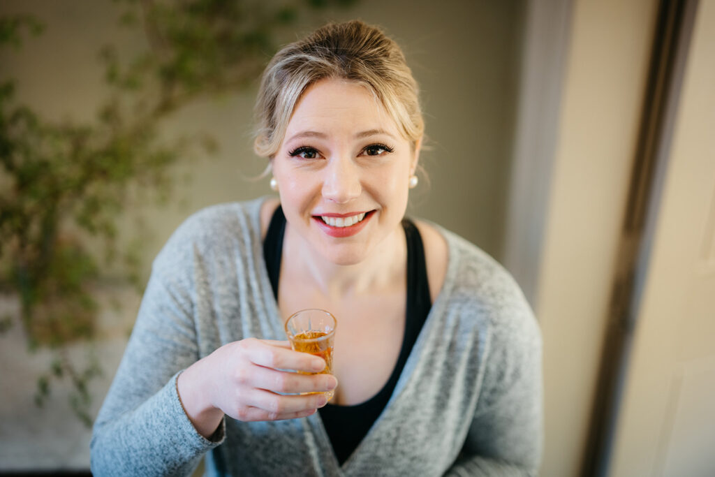 Brdie having a glass of champagne before her Spring Elopement in West Cork at Bantry House 
