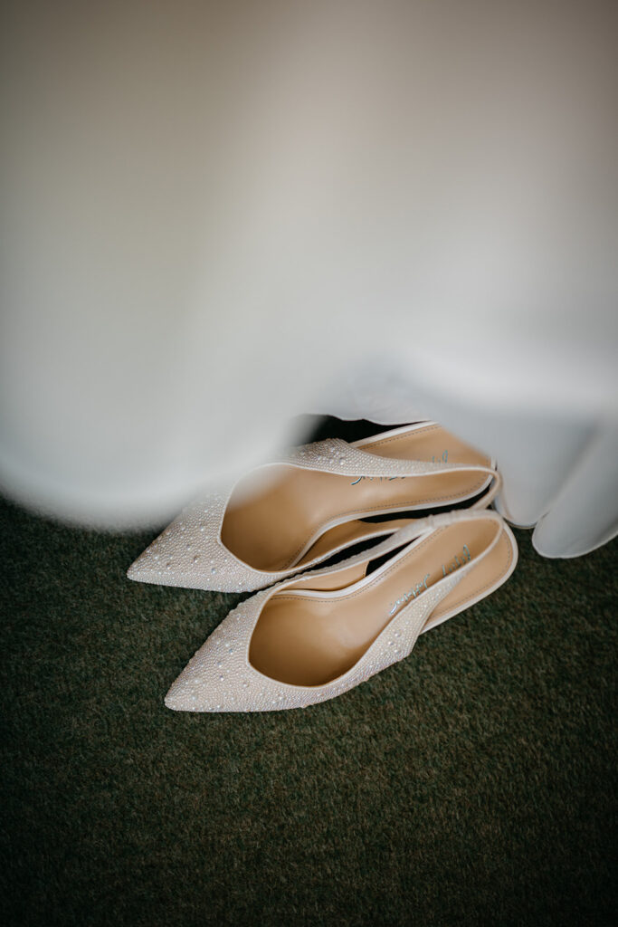 Spring Elopement in West Cork at Bantry House A pair of shoes beside the bed Spring Elopement in West Cork at Bantry House 