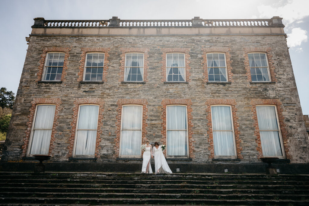bridal couple walk to their beautiful west Cork wedding ceremony at Bantry House.