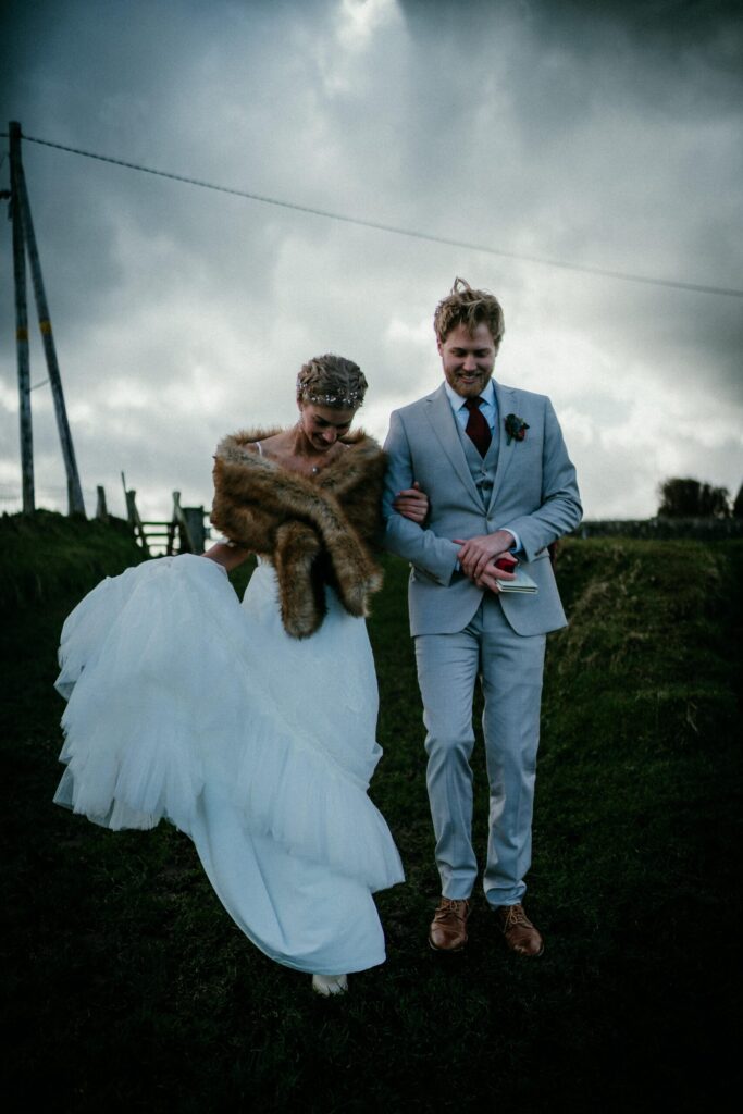 Our couple walk hand in hand to their ceremony in an Antrim Wedding in Ireland