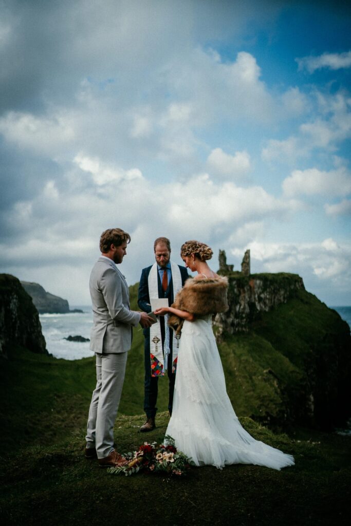 Ouir couple having therii vows at their Destination Wedding on the ANtrim coast