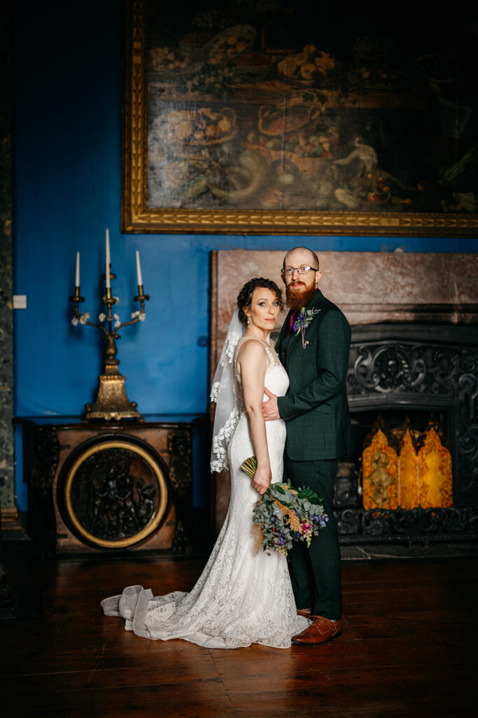 Ireland: The Perfect Elopement for a New Brunswick Couple standing close to gether in a majestic room in at Bantry House 