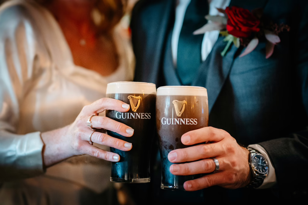 intimate ceremony at the cliffs of Moher Annie and Mike enjoying a pint of Guinness